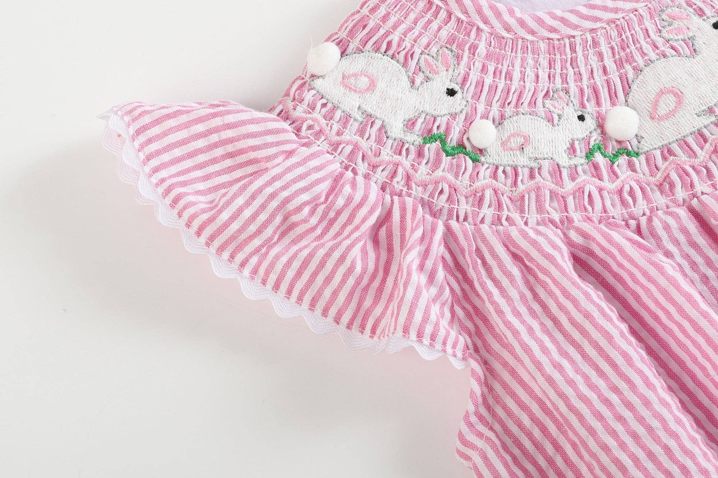 Pink Seersucker Running Bunnies Smocked Flutter Romper